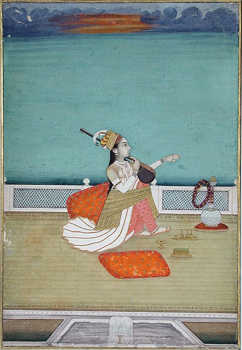 A beautiful woman seated on a terace playing a vina, , 