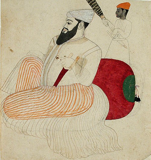 A fat, bearded ruler seated against a bolster, attended by a black chauri beare, , 