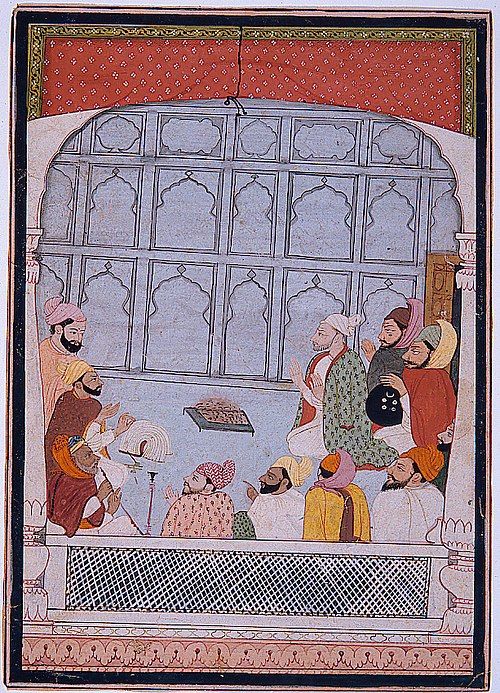 A group of men seated around a brazier, , 