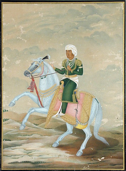 A horseman, dressed in green with a white-streaked turban, mounted on a blue ho, , 