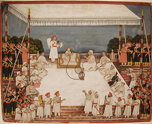 Young prince in durbar, smoking a hookah, , 