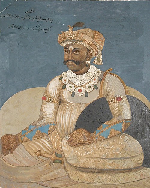 A Maratta raja seated against a bolster, , 