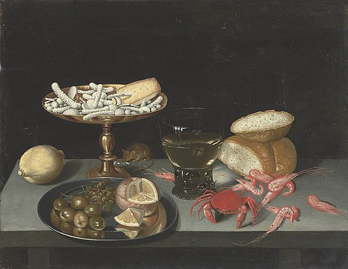Figs, olives, and a quartered orange on a silver platter, , Francesco Codino