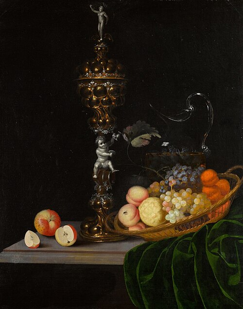Still life with an elaborate silver gilt standing cup, a basket of fruit, and a glass wine jug upon , , Georg Hainz