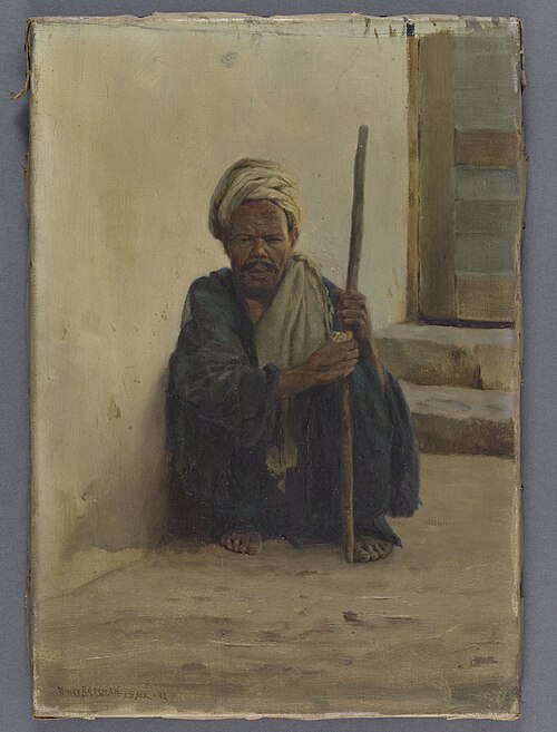 Louxor, arabe tenant un bâton assis dans une rue, 1892, Henry Brokmann