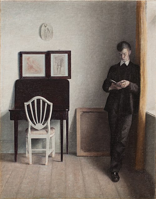 Interior with Young Man Reading, 1898, Vilhelm Hammershøi