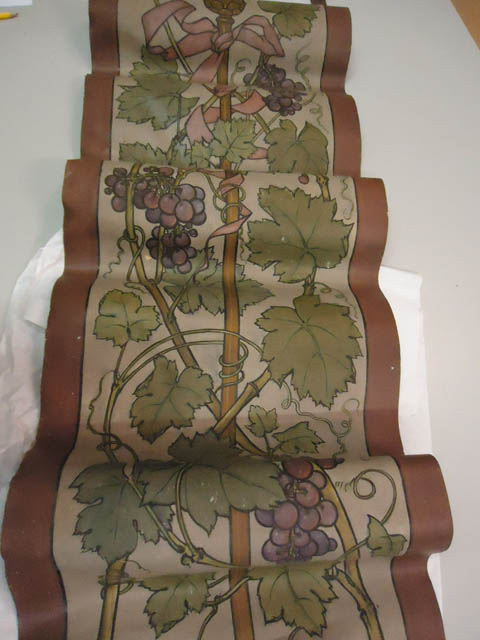 Decoratieband met wijnranken en druiven met in het midden een stok met een strik, 1909, Johan Bokhorst